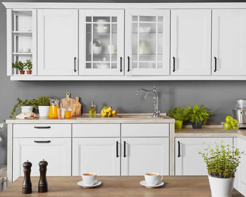 White cabinets against a darker wall paint.